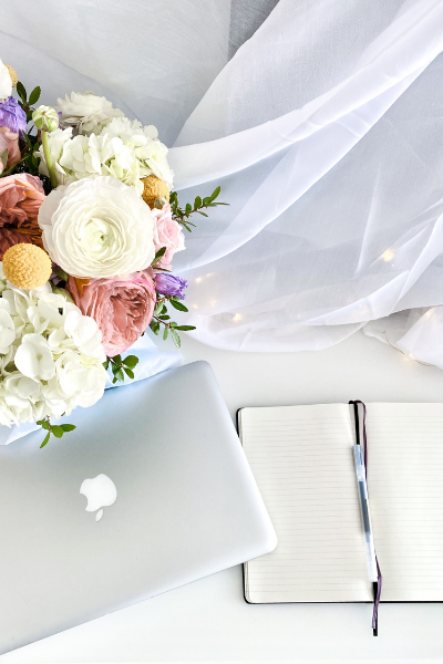 laptop book flowers